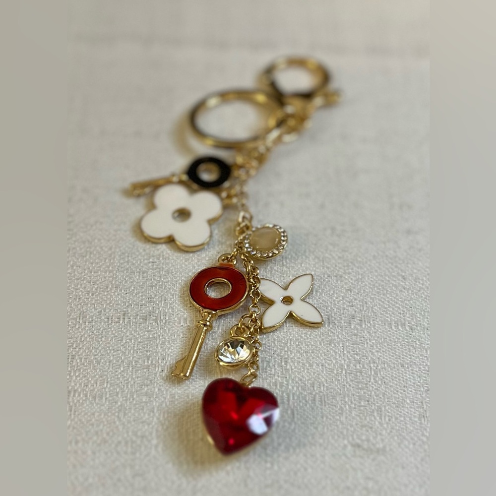 Gold-tone keychain bag charm floral design and  key accents